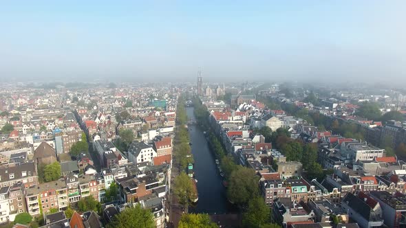 The foggy Amsterdam canal in autumn