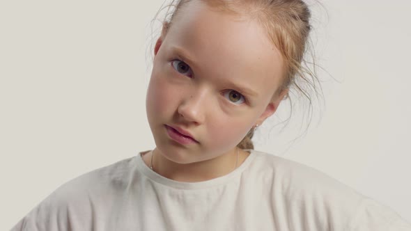 Young Girl in Studio Making Faces and Have Fun