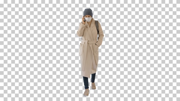 Young woman in protective mask walking, Alpha Channel