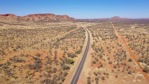 Australia outback desert road aerial near West MacDonnell National Park, Alice Springs, Northern Ter