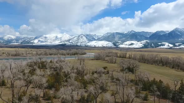 Snowcapped Mountains in Background of Desert Plains in Wyoming Spring