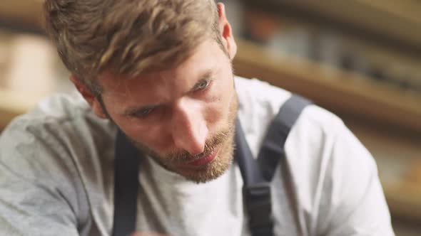 Portrait of a Man Ceramist at Work Potter Makes a Pitcher Out of Clay Handicraft Production of