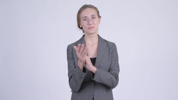 Happy Young Blonde Businesswoman Clapping Hands