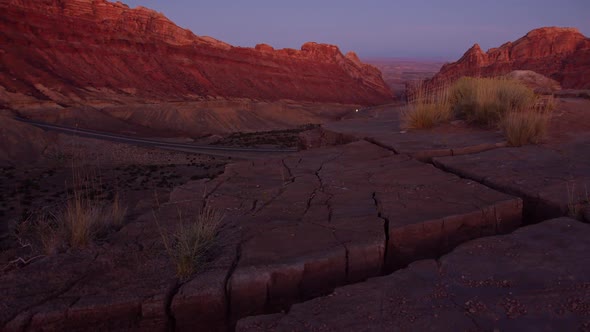 View of desert rocky terrain on cliff ledge viewing the Utah landscape