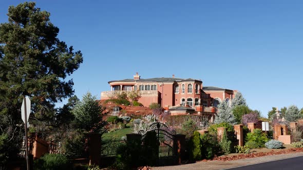 Luxury Mansion with Waterfall Wide Shot