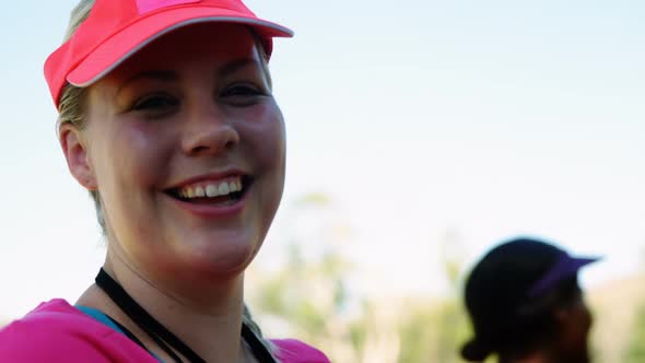 Portrait of happy woman in boot camp