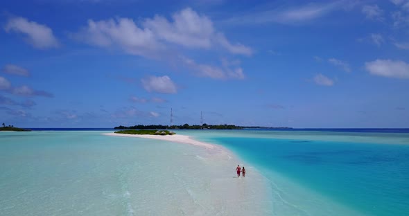 Young man and woman married on vacation spend quality time on beach on white sand background 4K