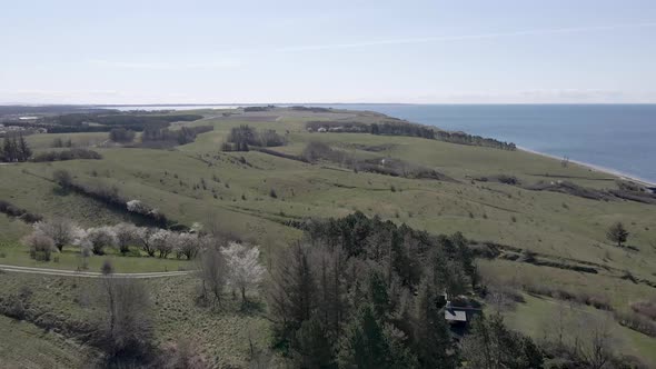 Drone footage of small beautiful rolling hills on the climate neutral danish island of Samsø.