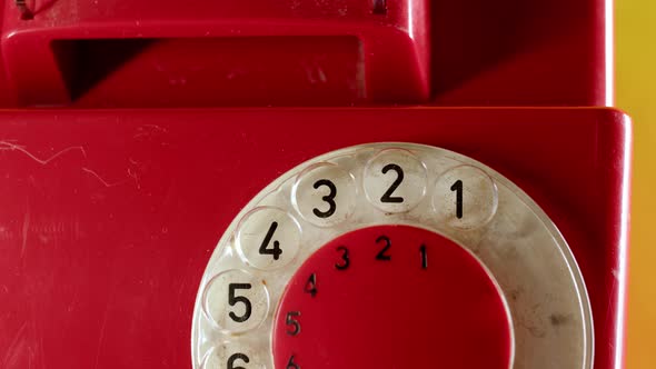 Close Up of Dialing on Old Vintage Red Dial Telephone