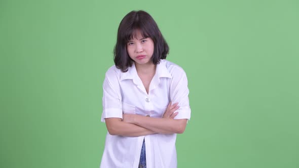 Stressed Asian Businesswoman Looking Bored and Tired