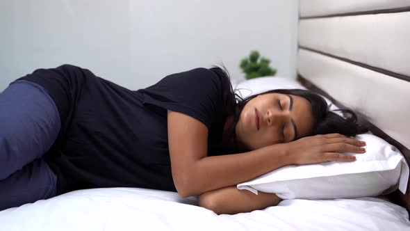 Indian woman going to bed to sleep