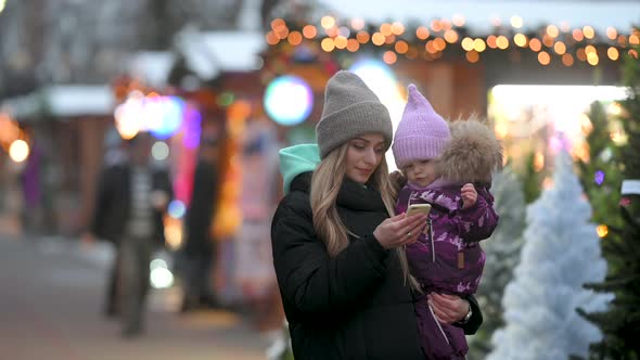 happy family is looking for Christmas tree decorations.