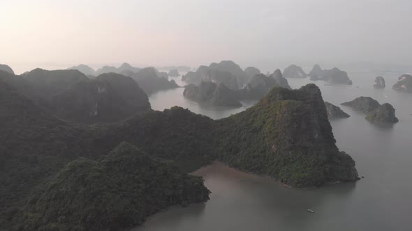 Aerial: unique flying over Ha Long Bay and Cat Ba island at sunset Vietnam