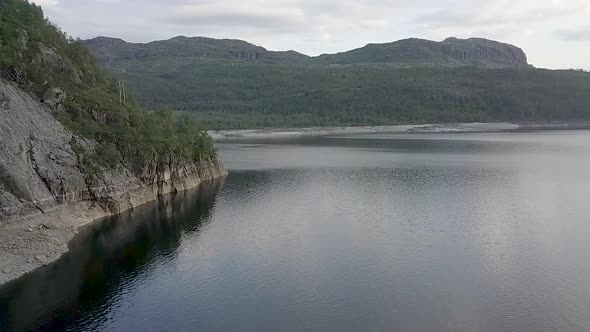 Drone shot of a cliff in a fjord of Norway.