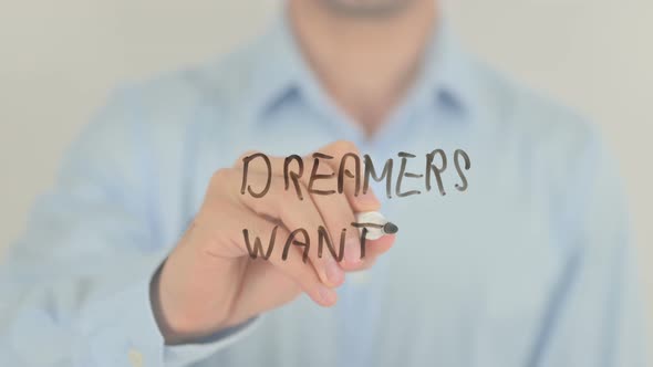 Dreamers Wanted, Man Writing on Transparent Screen