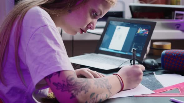 Young Woman Tattoo Artist Draws Sketch Tattoo Studio Front Laptop