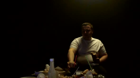 Fat Man Eating Junk Food Burgers and Hot Dogs and Watching TV, Slow Mo, Overweight