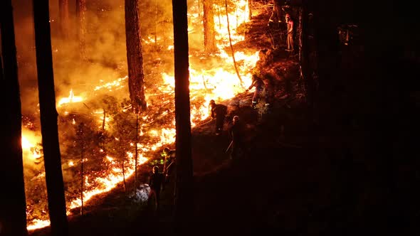 Firemen Battling Against Raging Fire