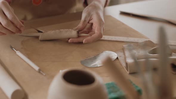 Woman Makes Clay Tableware Handmade in Ceramic Workshop