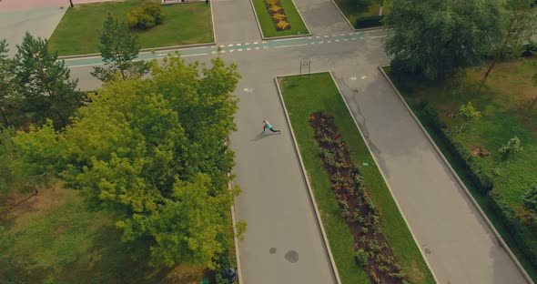 Athlete Warming Up in the Park on the Waterfront Training in the Summer