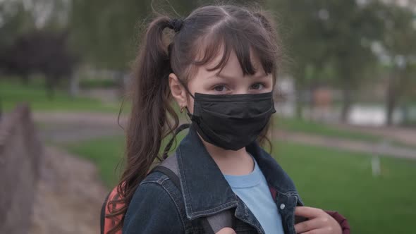 Child in mask with bag. 