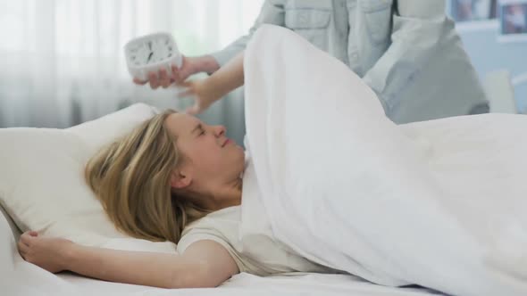 Troubled Teenage Daughter Does Not Want to Wake Up in Morning, Late for School