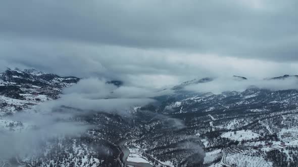 Clouds High in the Winter Mountains Aerial View 4 K