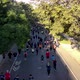 Runners on City Street Covered by Green Trees and Sunlight - VideoHive Item for Sale