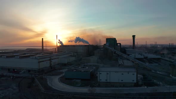 Industrial Zone with White Smoke Is Poured From the Factory Pipe in Contrast To the Sun. Pollution