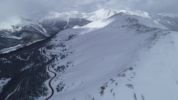 Storm brewing over the peaks on Loveland Pass, Colorado. Aerial views of mountains and highway 6.