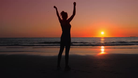 Woman in Fitness Clothes on the Ocean Shore She Enjoys Her Sport Successes