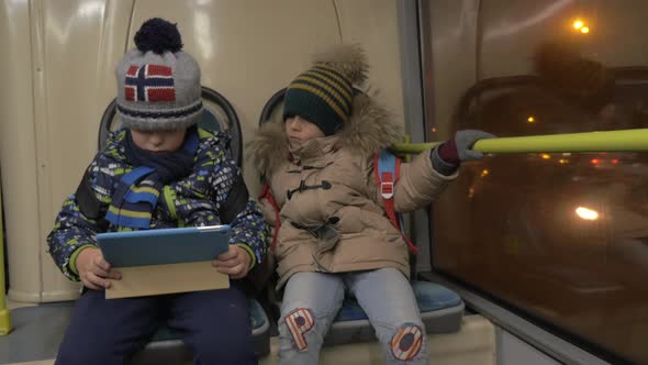 Two Young Boys in a Bus