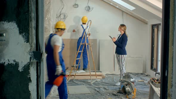 Construction Manager Controlling Building Site Using Digital Tablet alt