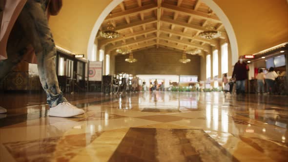 Slow Motion Woman in White Shoes Walking By Marble Floor in Railroad Station 6K