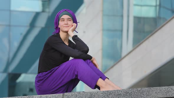 Beautiful Calm Peaceful Girl Islamic Muslim Woman Barefoot Lady Female Wears Purple Hijab Sits in