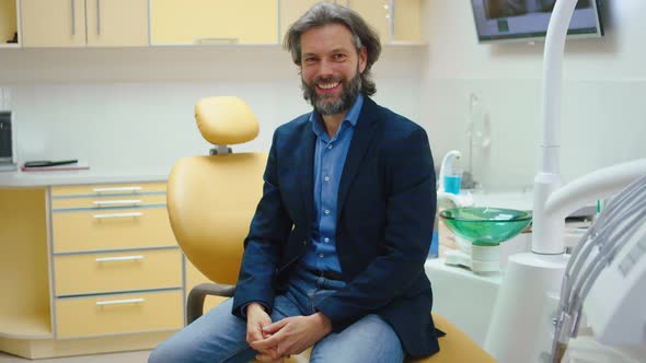 Charismatic Man Patient at Dental Clinic Take a