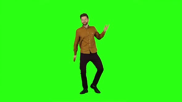 Guy Is Dancing Energetically, He Is Having Fun. Green Screen. Slow Motion