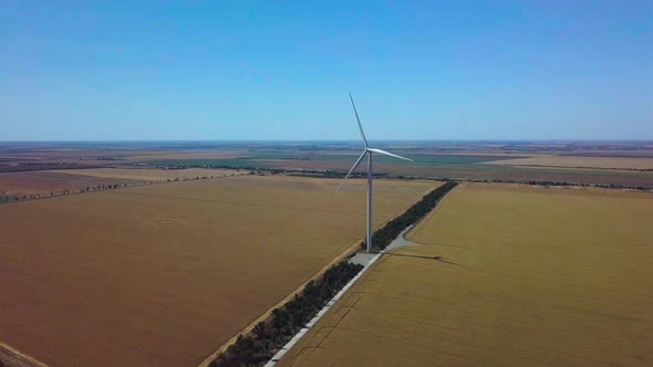 Aerial View of Windmills Rotating By the Force of the Wind and Generating Renewable Energy. 