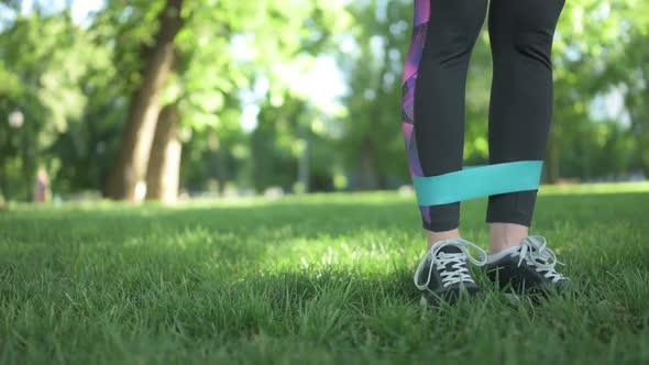 Girl Exercising with Rubber Band