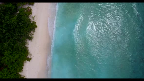 Aerial drone view seascape of exotic shore beach trip by blue green ocean and bright sand background