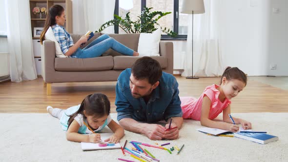 Father with Little Daughters Drawing at Home 18