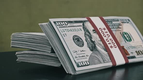 Dollars Bundles Rotate on Green Background Heap of Money