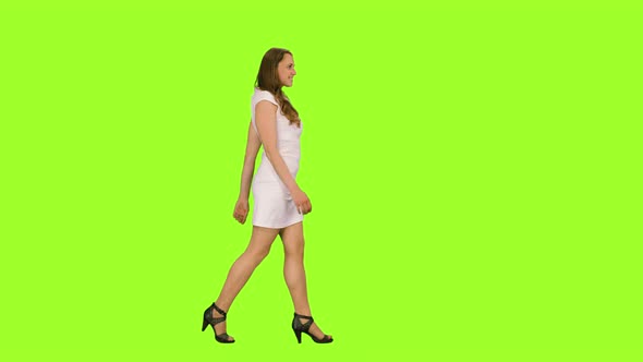 Lovely Young Female in White Dress Walking on Green Background, Chroma Key