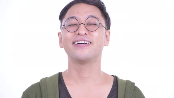 Face of Happy Japanese Man Relaxing with Eyes Closed