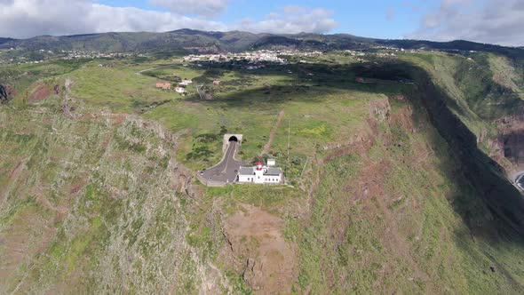 Flying over Ponta do Pargo lighthouse, built on a cliff, Madeira, Portugal