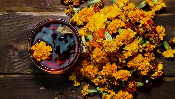 Natural Tea From Marigold Flowers From Above, Tea For Colds. Naturotherapy Medicinal Drink. Top View