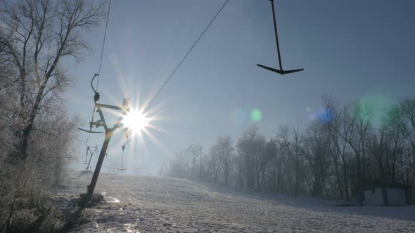 Early morning  sun over Kraljevica hill ski slopes 4K 2160p UHD tilting footage - Ski slopes near Ea