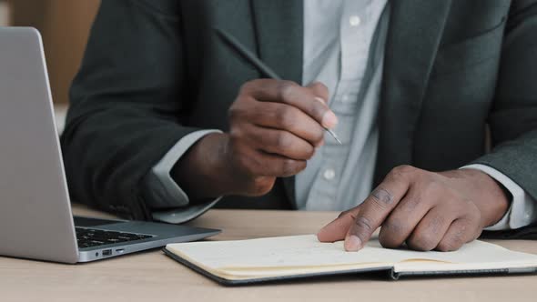 Closeup Male Hands Writing in Notebook with Pen Make Notes Information Financial Analysis Startup