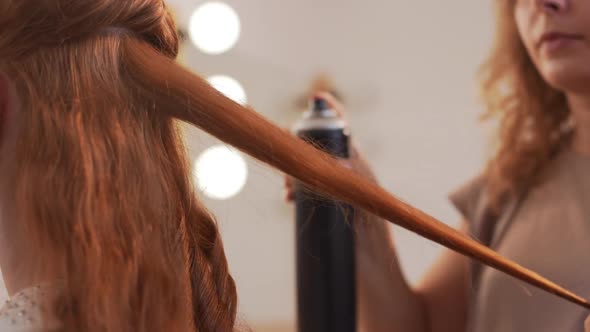 Female Hairdresser Making Hairstyle to Foxy Girl in Beauty Salon Slow Motion