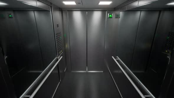 Empty, modern elevator with brushed steel walls traveling upwards in a loop 4KHD